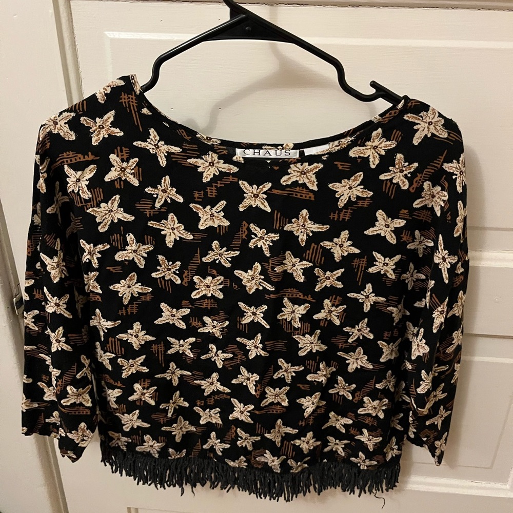 Patterned with fringe on the bottom blouse